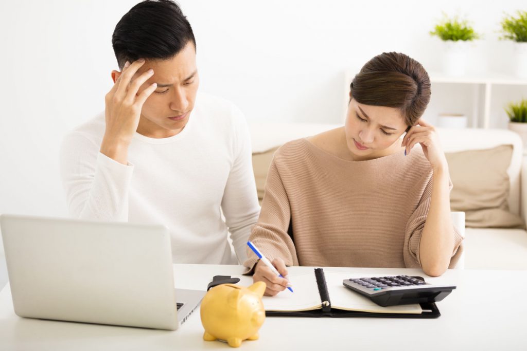 husband and wife with financial stress
