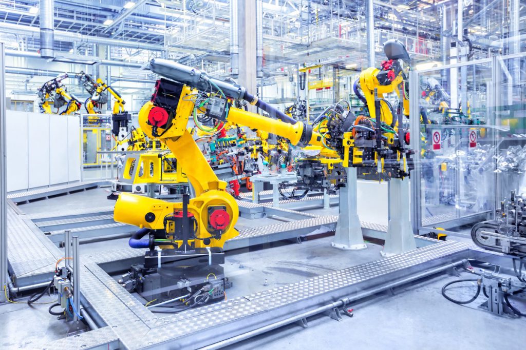 robotic arms in a car plant