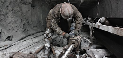 miner performs work in a mine