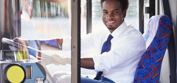 Portrait Of Bus Driver Behind Wheel