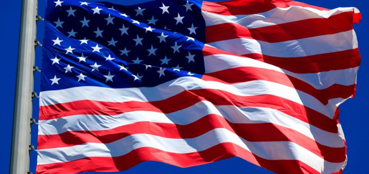 Flag of the USA against a blue sky