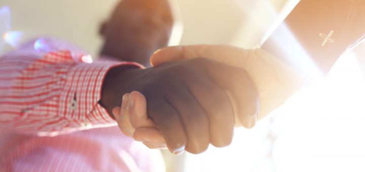 Business people shaking hands, finishing up a meeting