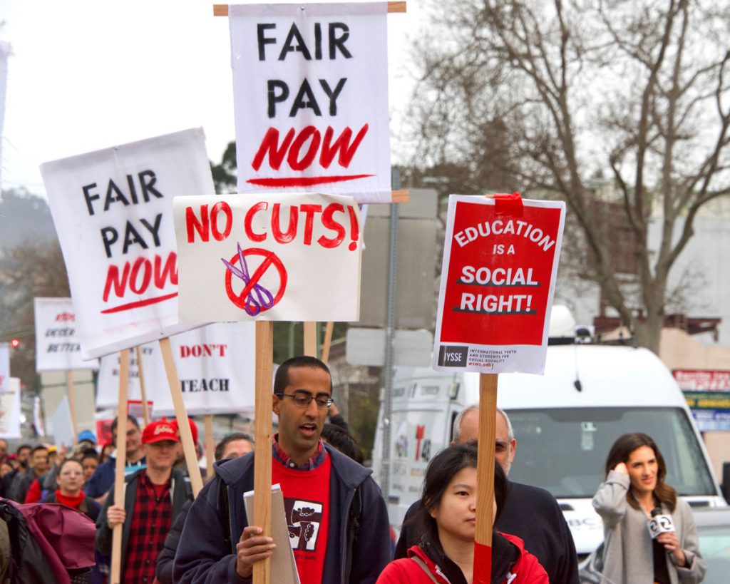 Oakland, CA - January 18, 2019: Oakland teachers having a one day "sick out" to protest slow progress on contract talks with the district. Fighting for smaller class sizes and bigger paychecks.