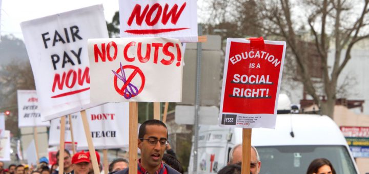Oakland, CA - January 18, 2019: Oakland teachers having a one day "sick out" to protest slow progress on contract talks with the district. Fighting for smaller class sizes and bigger paychecks.