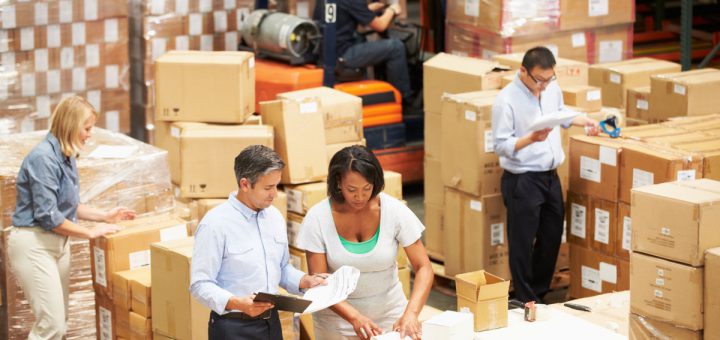 Workers In Warehouse Preparing Goods For Dispatch