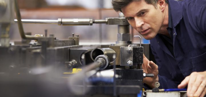 Factory Engineer Operating Hydraulic Tube Bender