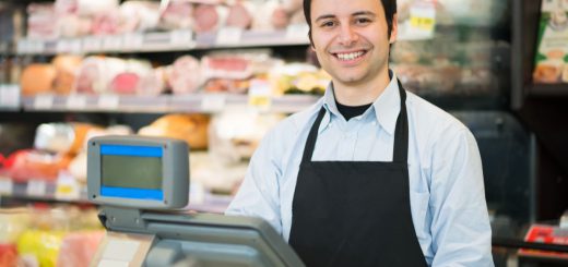 Portrait of a smiling shopkeeper in a grocery store