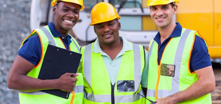 portrait of smiling construction workers