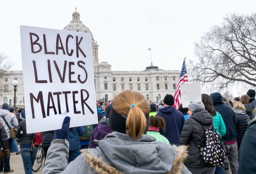 ST. PAUL, MN/USA - MARCH 24, 2018: Unidentified individual carrying Black Lives Matter sign at the March for our Lives protest at the Minnesota State Capitol.