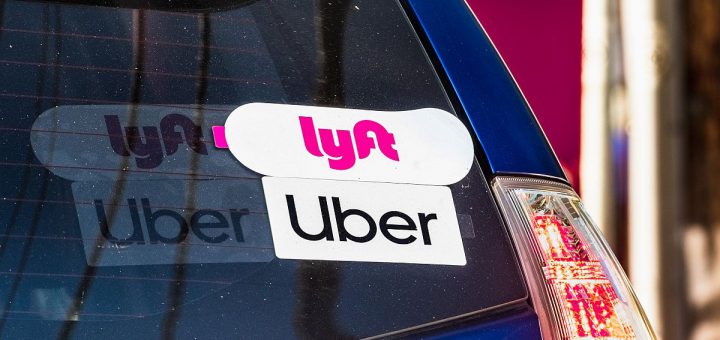 Oct 10, 2019 Mountain View / CA / USA - Lyft and UBER stickers on the rear window of a vehicle offering rides in San Francisco Bay Area