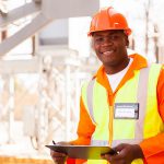 handsome male african electrical engineer in substation