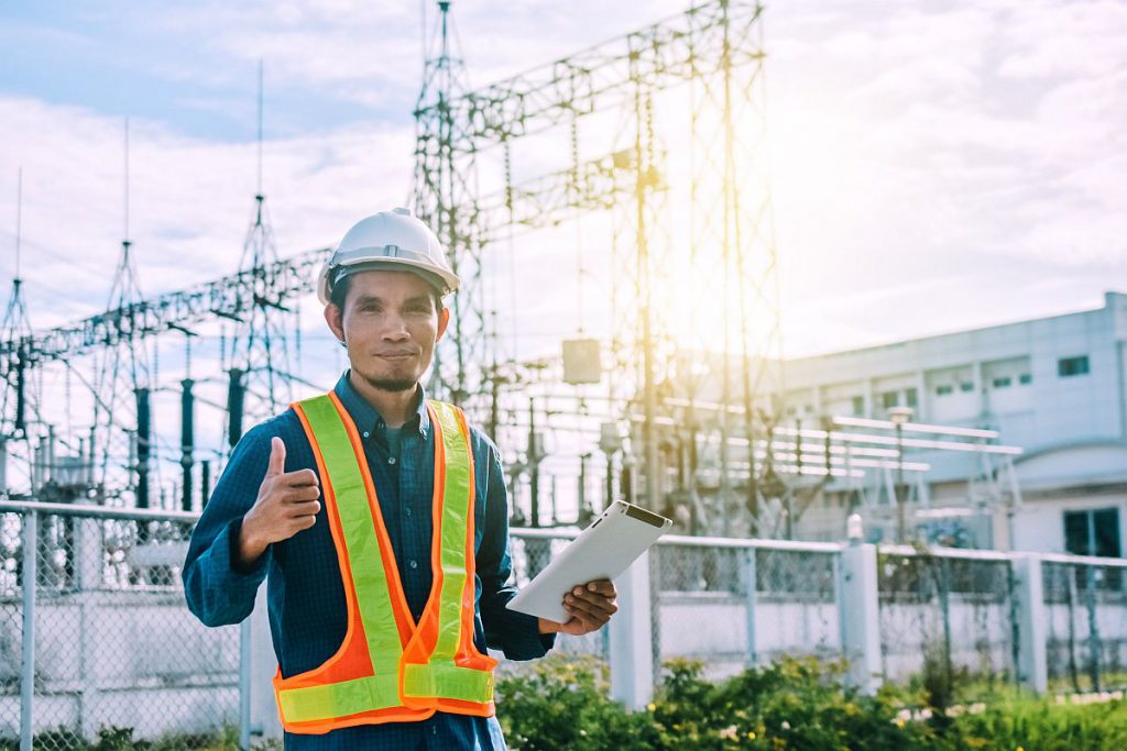 Engine Currently holding a tablet and a power plant with the Electricity Authority