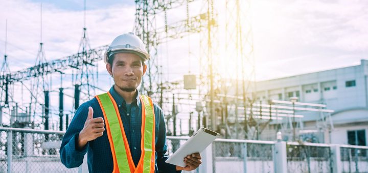 Engine Currently holding a tablet and a power plant with the Electricity Authority