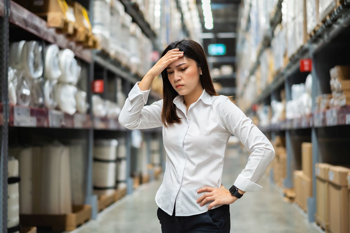 stressed female manager in the warehouse store; Great Resignation labor unions concept