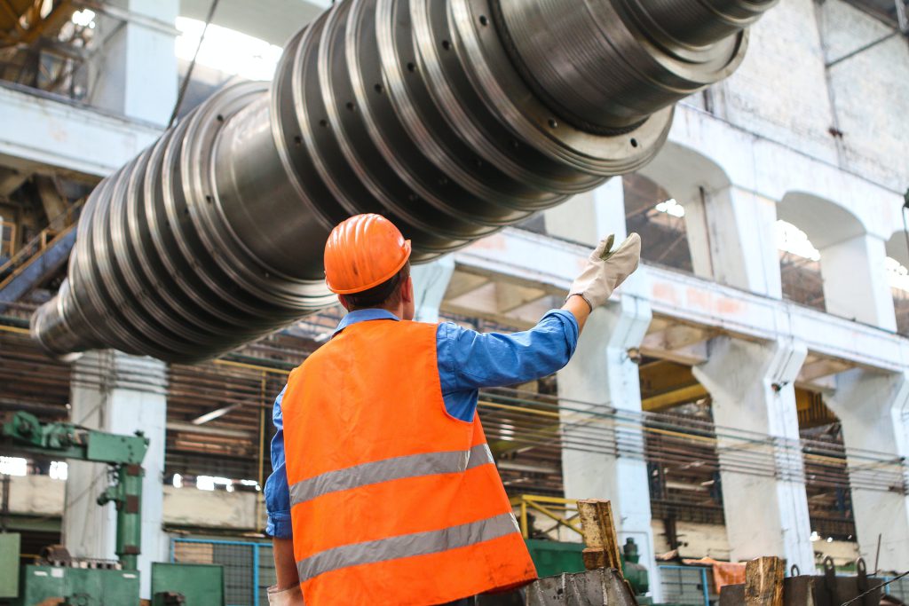 Worker in hard hat in factory; concept next generation of workers