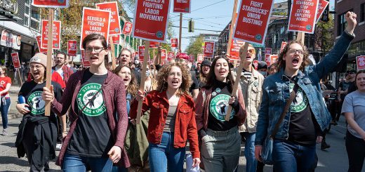 starbucks workers protests holding signs and marching