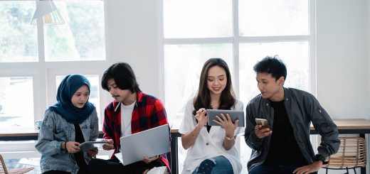 young people in group with laptops and phones; demographics of the new labor movement concept