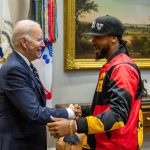 President Biden shaking hands with Amazon union organizer Christian Smalls; Young union organizers concept