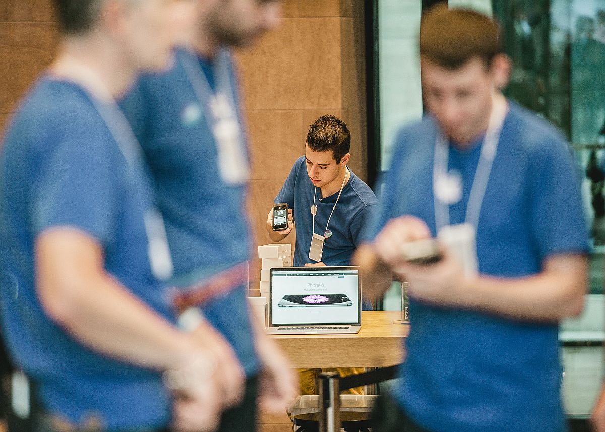 Workers at an Apple store; union victories concept.