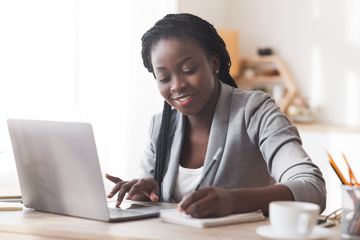 Professional woman working at desk; pro-worker initiatives concept