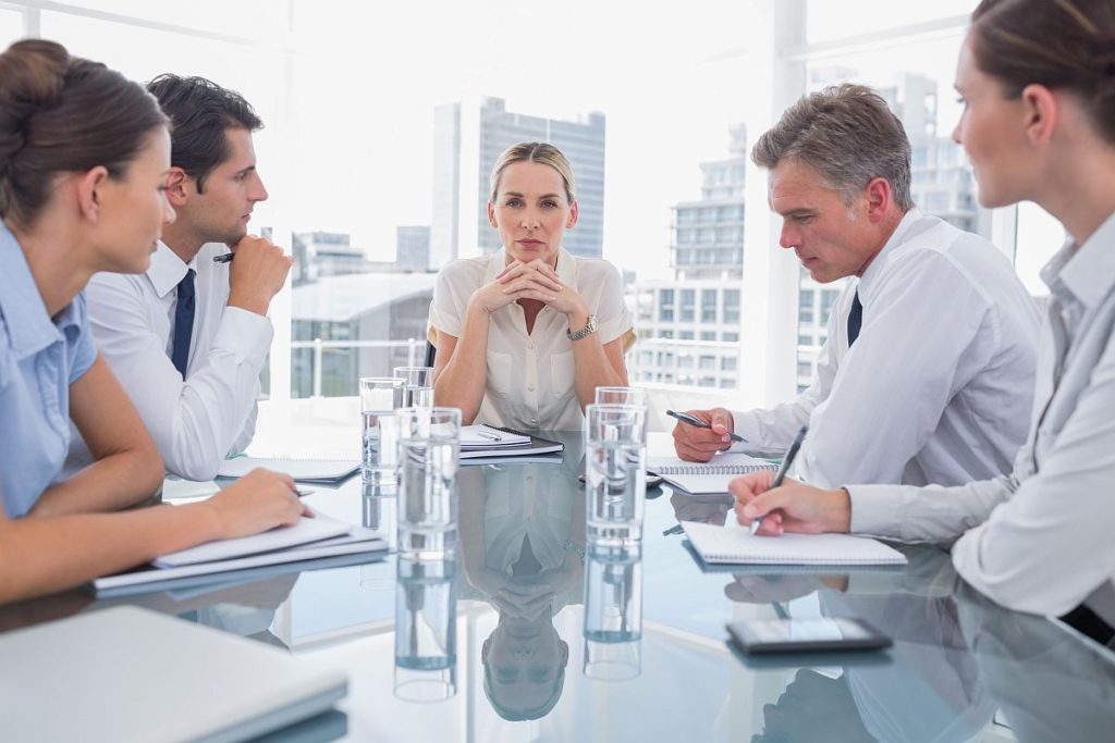 Professionals meeting in a boardroom; contract negotiations concept
