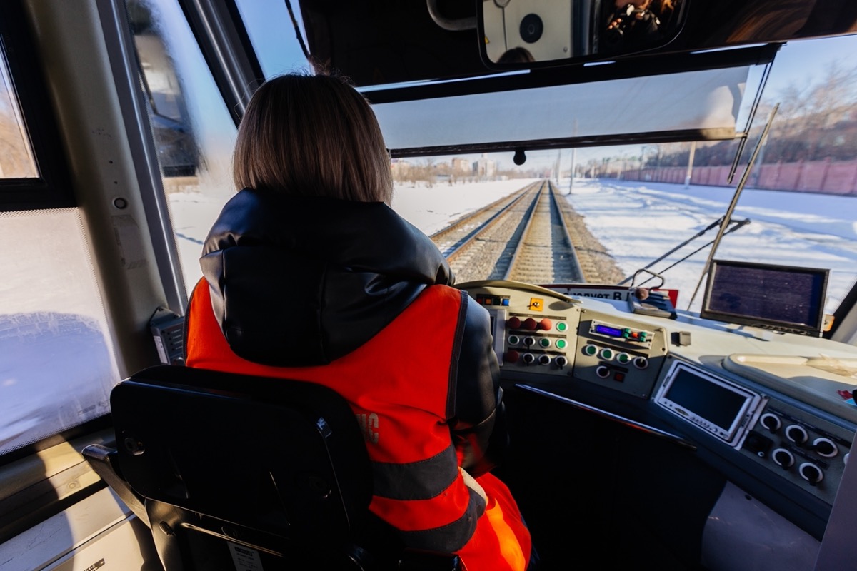 Female train driver; rail unions concept.