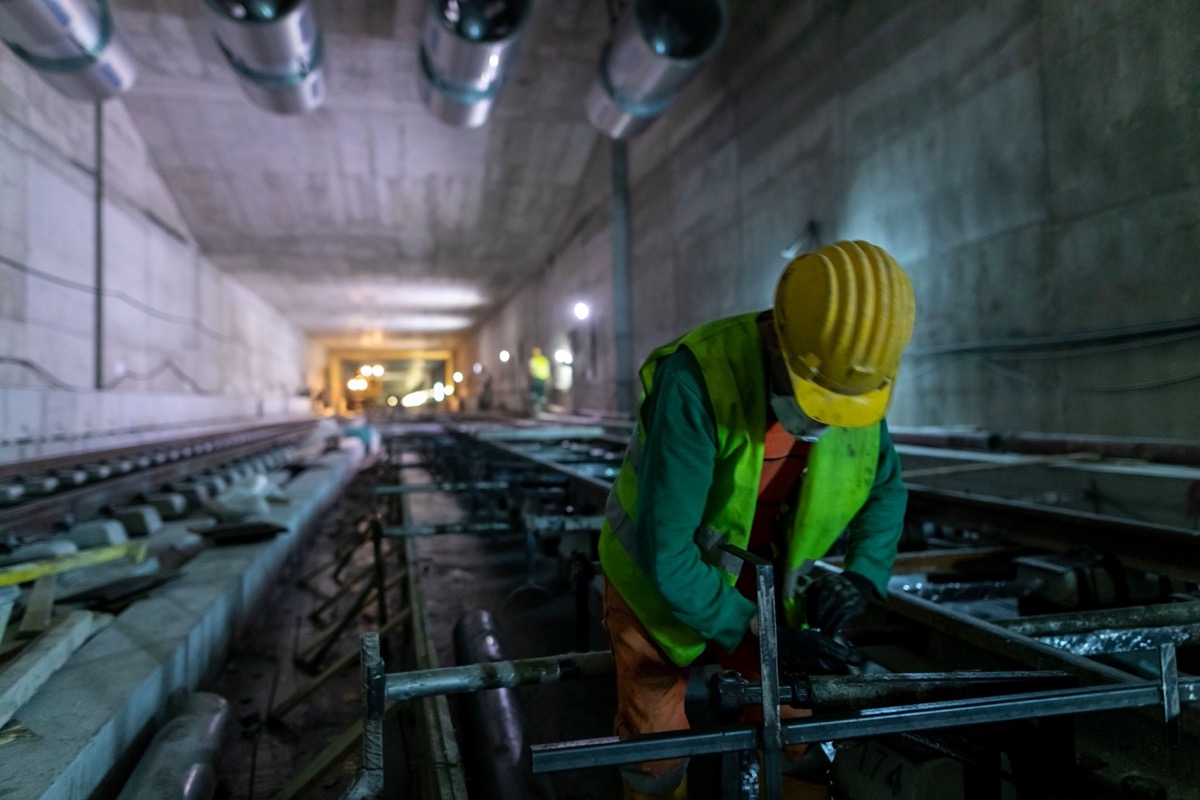 Railway worker pictured in construction of subway; rail unions concept