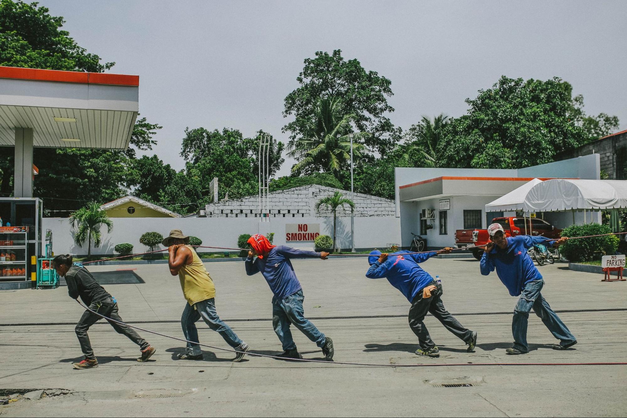 five worker pulling a rope together; americans union support concept