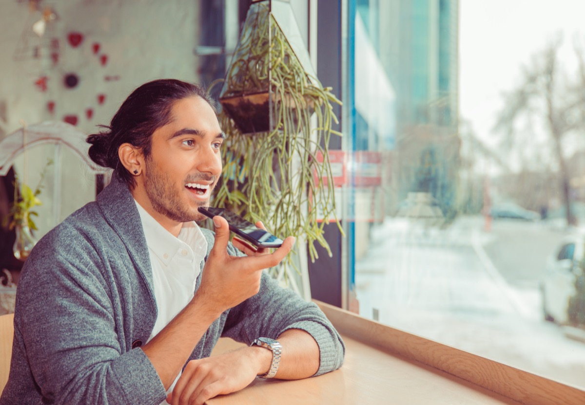 Young adult talking on his phone; choosing a union concept
