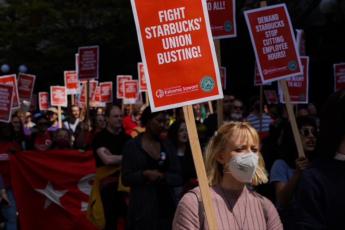 Activists march at the Starbucks Worker Solidarity Rally in support of unionization for baristas and other retail workers; propel new labor movement concept