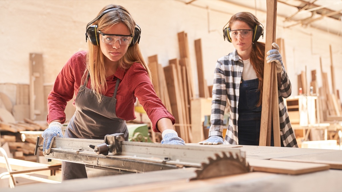 Two woodworkers at work wearing safety glasses; DOL initiatives concept