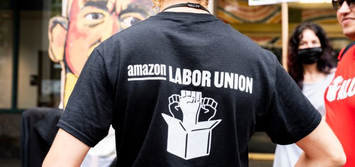 Amazon worker wearing 'Amazon Labor Union' t-shirt; Amazon vs. ALU concept