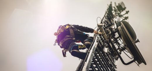 Telecom worker climbing antenna tower; safer working conditions concept
