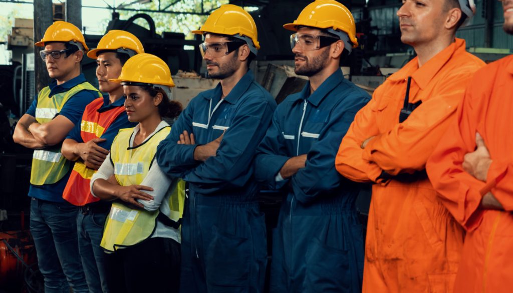 Group of workers standing together; federal and state labor laws concept