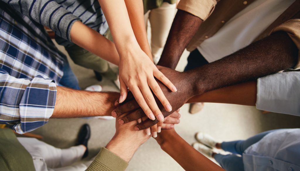 Hands together, a symbol of unity; state legislative victories concept