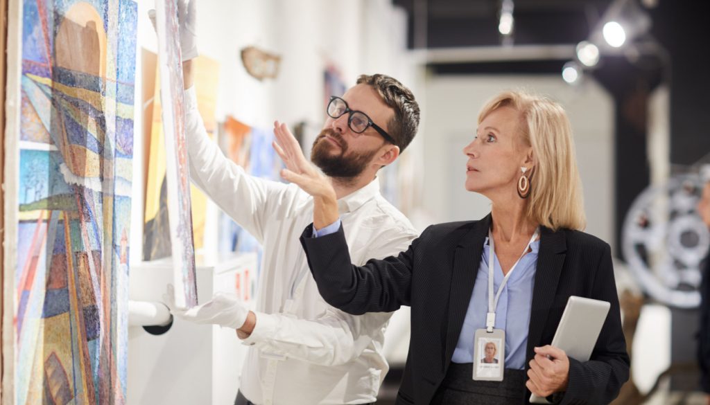 Culture workers deciding on art pieces; Mid-2023-Worker-Wins concept