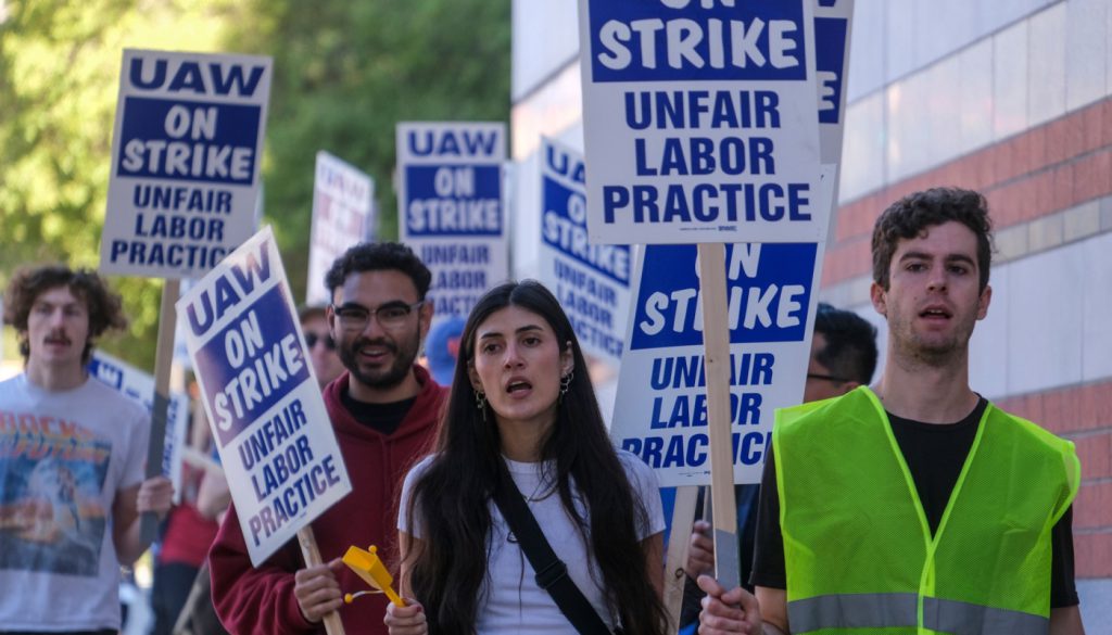 Young people picketing.; worker solidarity concept