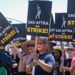 Striking writers and actors picketing; worker solidarity concept