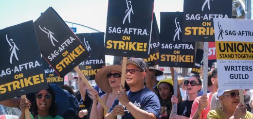 Striking writers and actors picketing; worker solidarity concept