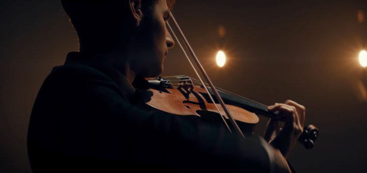 Violinist playing; music industry workers concept